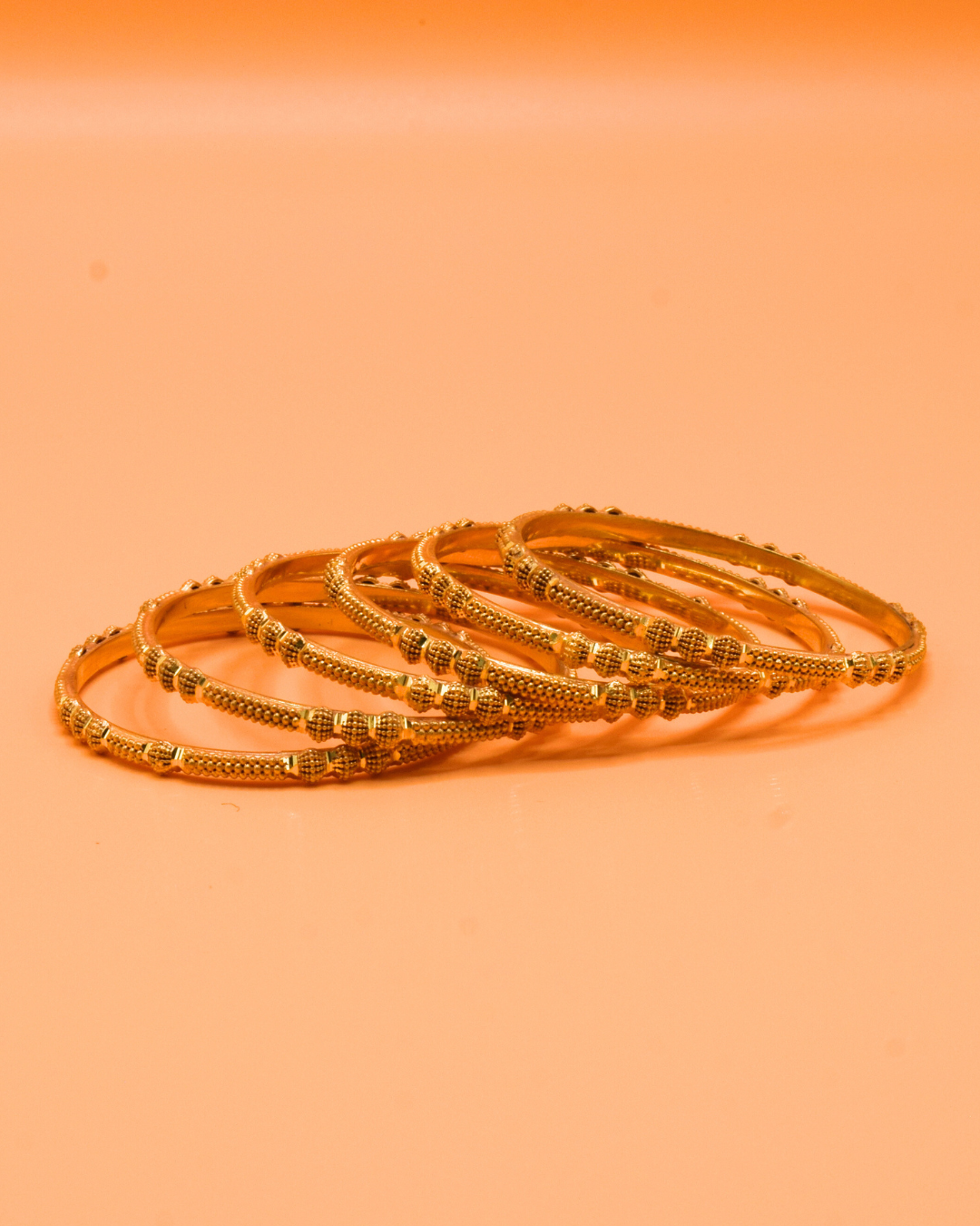 GOLD BANGLES